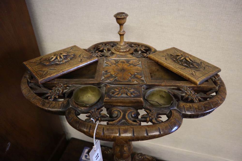 A 19th century Alpine carved fruitwood smokers compendium,